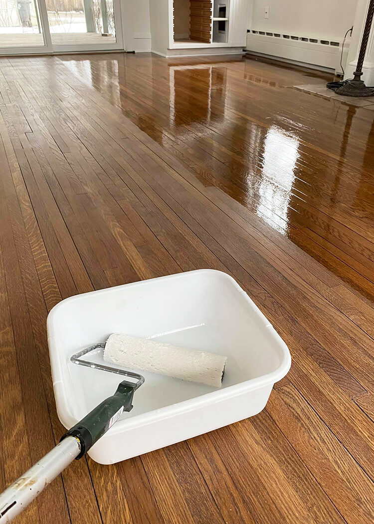 Applying finish on stained wood floor